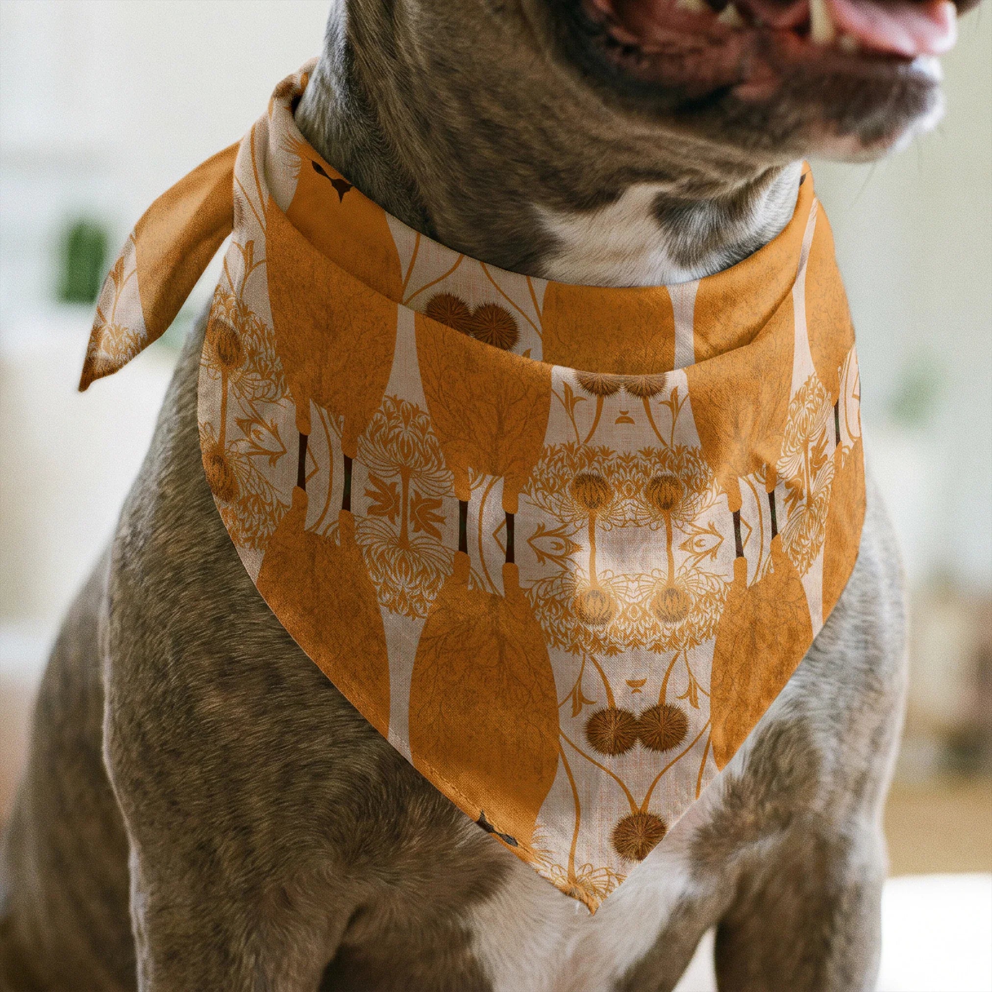 Symmetrical pattern of orange owls with brown details on beige background with decorative floral ele