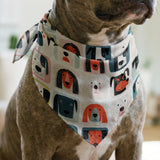 Colorful grid pattern of stylized dog faces in various breeds with geometric shapes and retro color