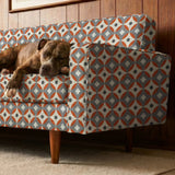 Mod Montez in Fire — mod montez print, in a cream star on a bright orange ground with a charcoal center