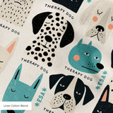 Colorful therapy dog illustration pattern featuring various dog breeds in teal, black, cream and pin