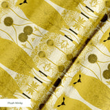 Stylized golden owls in symmetrical Art Nouveau pattern with floral motifs on cream background