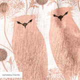 Symmetrical pattern of stylized pink owls with decorative floral medallions on white background