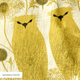 Stylized golden owls in symmetrical Art Nouveau pattern with floral motifs on cream background