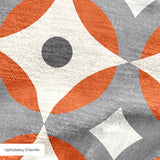 Mod Montez in Fire — mod montez print, in a cream star on a bright orange ground with a charcoal center